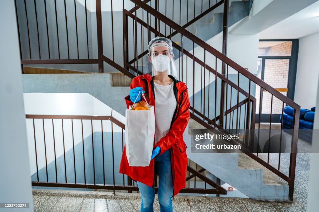Woman delivering groceries during lockdown