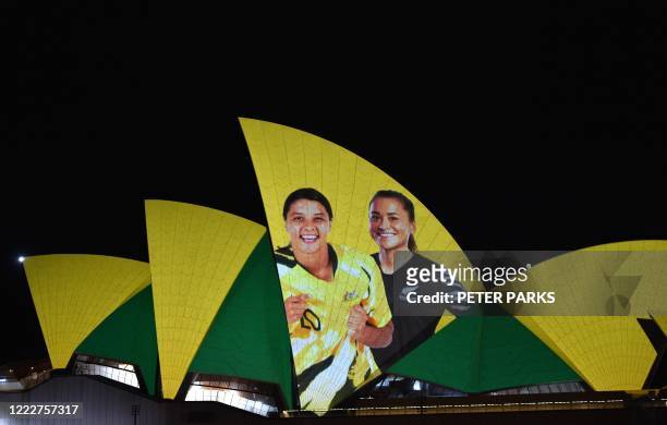 Sydney Opera House is lit in celebration of Australia and New Zealands joint bid to host the FIFA Womens World Cup 2023, in Sydney on June 25, 2020....