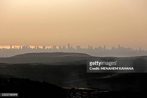 Picture taken from the Israeli settlement of Naale in the occupied West Bank northwest of the Palestinian city of Ramallah shows the skyline of the...