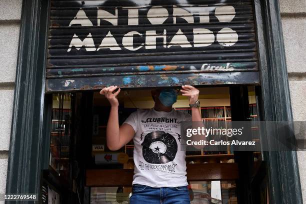 Mirel Chetan lifts the closing of the Antonio Machado bookstore after 51 days of closure due to coronavirus on May 04, 2020 in Madrid, Spain. Spain...