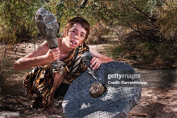 confused cave boy - caveman stockfoto's en -beelden