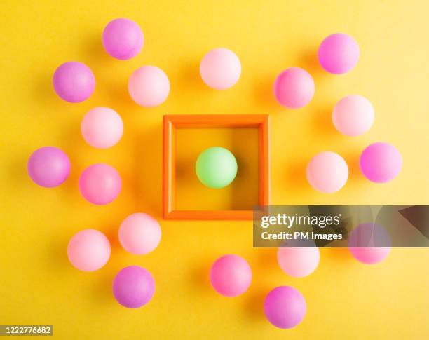 quarantined little green ball - business confuse conflict stock-fotos und bilder