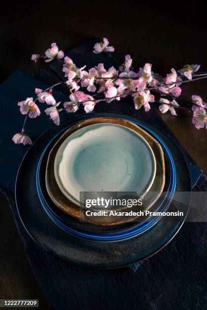 several empty plates stacked - household equipment stock pictures, royalty-free photos & images