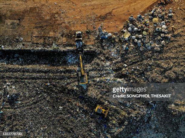aerial view/waste pits, which are places to receive waste from the city to enter the disposal and sorting for recycling. - coal mine stock photos et images de collection