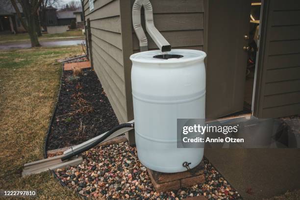 rain barrel - rain gutter imagens e fotografias de stock