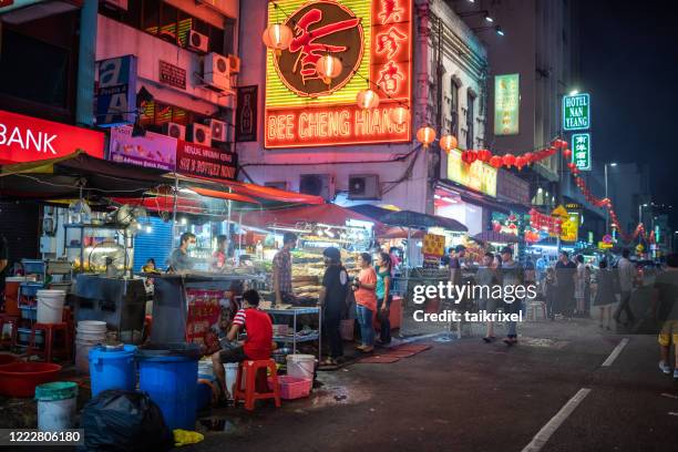 food stand in chinatown, kuala lumpur - broiling stock pictures, royalty-free photos & images