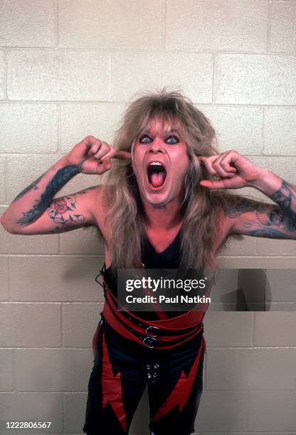 Portrait of American Heavy Metal musician Chris Holmes, of group WASP, as he poses backstage at the Riviera Theater, Chicago, Illinois, January 19,...