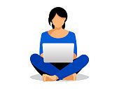Girl blogger in lotus pose is sitting on floor with laptop. Work in social media.