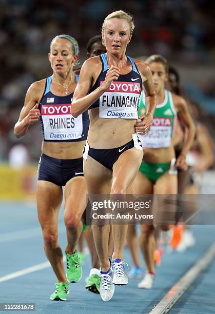 Jennifer Rhines and Shalane Flanagan of United States compete in the women's 10,000 metres final during day one of the 13th IAAF World Athletics...