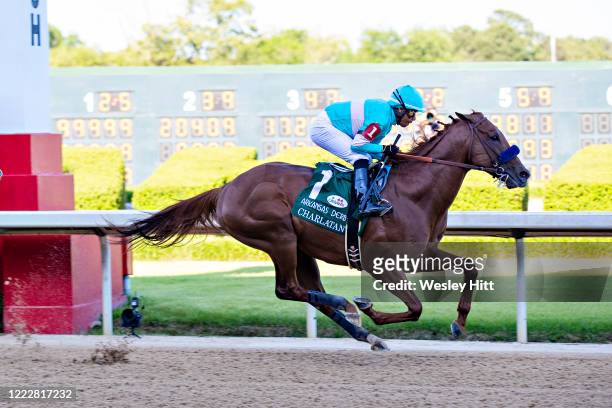 Jockey Martin Garcia rides Charlatan to the lead during the 84th running of The Arkansas Derby Grade 1 at Oaklawn Racing Casino Resort on Derby Day...