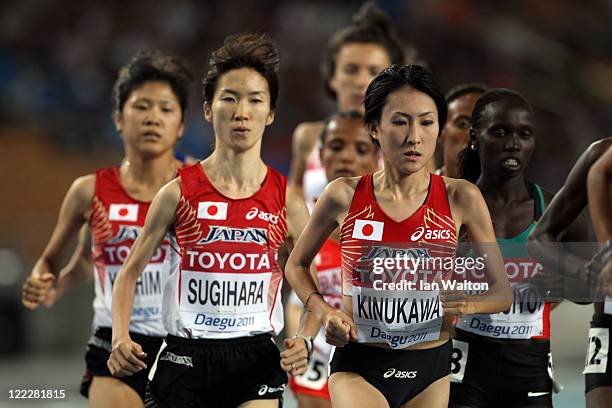 Megumi Kinukawa and Kayo Sugihara of Japan competes in the women's 10,000 metres final during day one of the 13th IAAF World Athletics Championships...