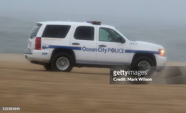 Ocean City police vehicle patrols the beach as winds and high tides from approaching Hurricane Irene start hit the area, on August 27, 2011 in Ocean...