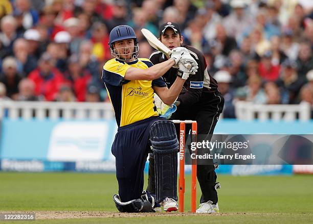 James Vince of Hampshire hits out watched by Craig Kieswetter of Somerset during the Friends Life T20 semi final match between Hampshire and Somerset...