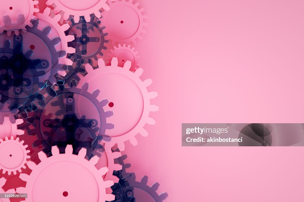 Gear on pink background, minimal teamwork concept