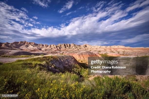 late afternoon light over the badlands, badlands national park, south dakota - badlands national park stock pictures, royalty-free photos & images