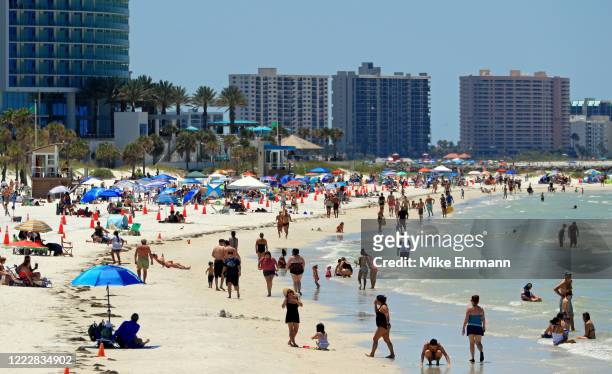 People visit Clearwater Beach after Governor Ron DeSantis opened the beaches at 7am on May 04, 2020 in Clearwater, Florida. Restaurants, retailers,...