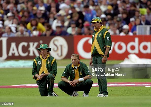 Lance Klusener, Allan Donald and Hansie Cronje of South Africa discuss tactics during the World Cup Super Six match against Australia at Headingley...