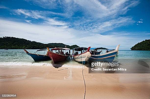 boats on beach - pulau langkawi stock pictures, royalty-free photos & images