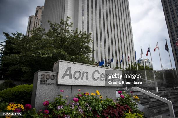 Signage is displayed outside the Aon Center in Chicago, Illinois, U.S., on Thursday, June 24, 2020. After a three-month mandatory hiatus,...