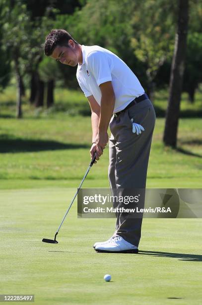 Toby Tree of Great Britain and Ireland makes a putt during his Singles match against Thomas Detry of the Continent of Europe during the final day of...