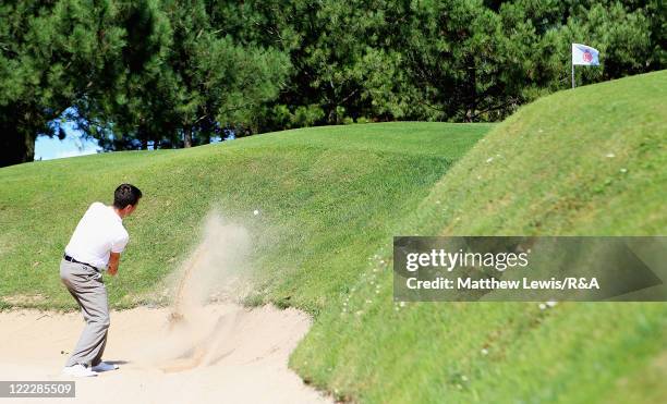 Toby Tree of Great Britain and Ireland plays out of a bunker during his Singles match against Thomas Detry of the Continent of Europe during the...