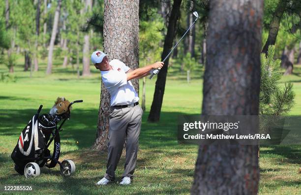 Callum Shinkwin of Great Britain and Ireland plays a shot from the rough during his Singles match against Kristoffer Ventura of the Continent of...