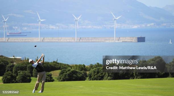 Kristoffer Ventura of the Continent of Europe plays a shot from the fairway during his Singles match against Callum Shinkwin of Great Britain and...