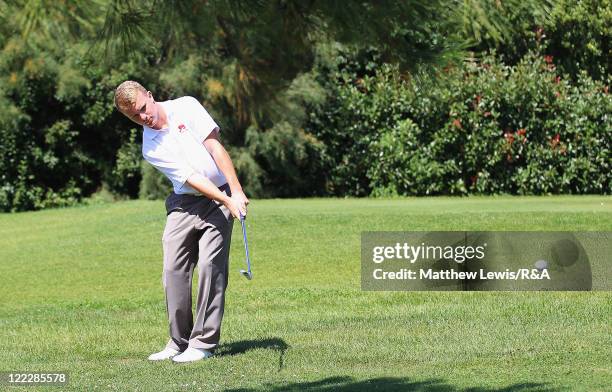 Paul Kinnear of Great Britain and Ireland plays a chip shot during his Singles match against Florian Loutre of the Continent of Europe during the...