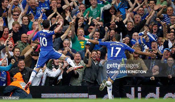 Chelsea's Spanish midfielder Juan Mata celebrates scoring his goal with Chelsea's Portuguese defender Jose Bosingwa during the English Premier League...