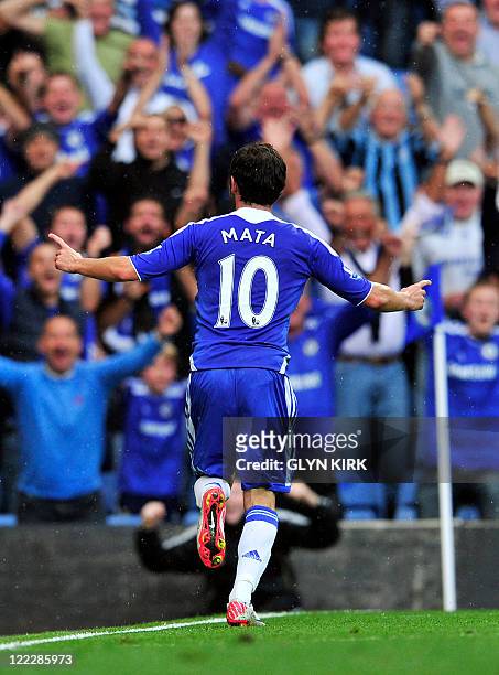 Chelsea's Spanish midfielder Juan Mata celebrates scoring the third goal on his debut during the English Premier League football match between...