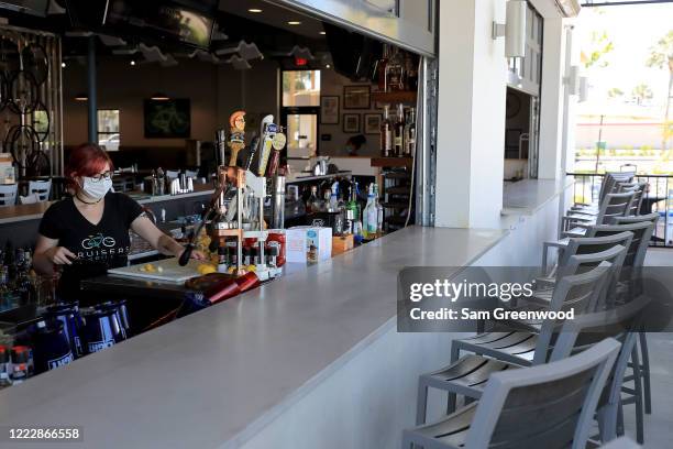 Employees of Cruisers Grill prepare for customers as the state of Florida enters phase one of the plan to reopen the state on May 04, 2020 in...