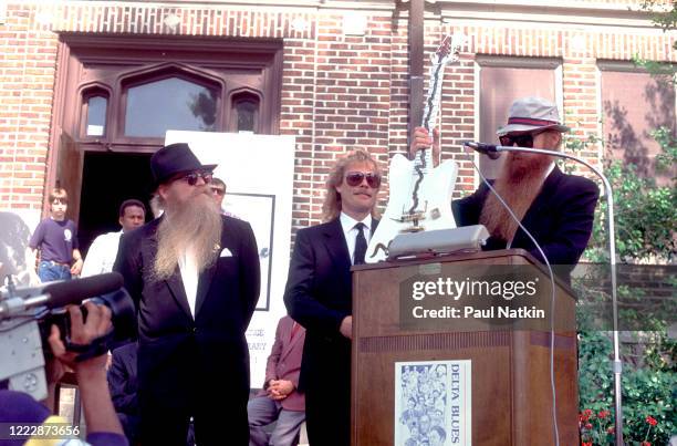 Members of the American Rock group ZZ Top present the 'Muddywood' guitar to the Carnegie Public Library's Delta Blues Museum, Clarksdale,...