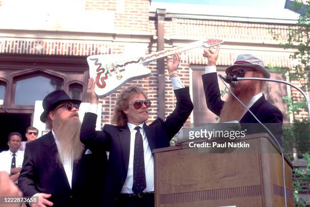Members of the American Rock group ZZ Top present the 'Muddywood' guitar to the Carnegie Public Library's Delta Blues Museum, Clarksdale,...