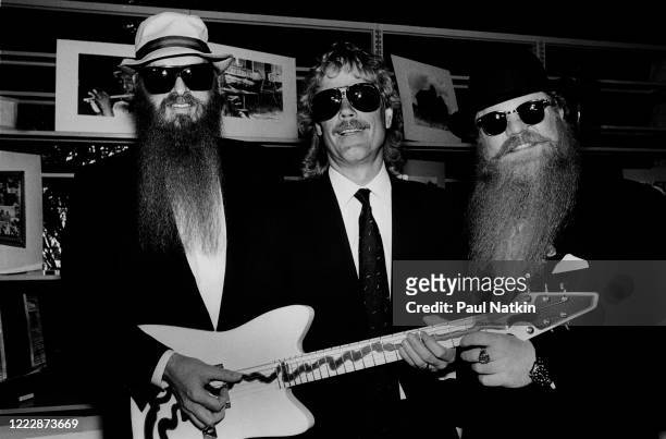 Members of the American Rock group ZZ Top present the 'Muddywood' guitar to the Carnegie Public Library's Delta Blues Museum, Clarksdale,...