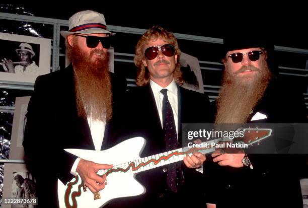 Members of the American Rock group ZZ Top present the 'Muddywood' guitar to the Carnegie Public Library's Delta Blues Museum, Clarksdale,...