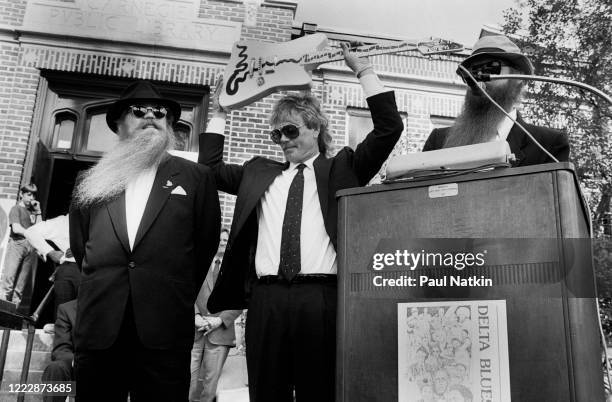 Members of the American Rock group ZZ Top present the 'Muddywood' guitar to the Carnegie Public Library's Delta Blues Museum, Clarksdale,...