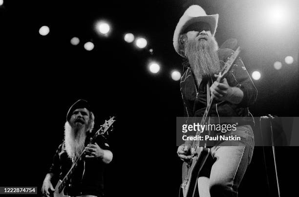 American Rock musicians Dusty Hill and Billy Gibbons, both of the group ZZ Top, perform onstage at the Poplar Creek Music Theater, Hoffman Estates,...