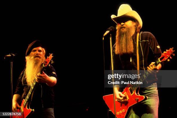 American Rock musicians Dusty Hill and Billy Gibbons, both of the group ZZ Top, perform onstage at the Poplar Creek Music Theater, Hoffman Estates,...