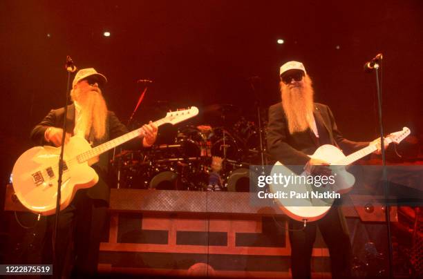 American Rock musicians Dusty Hill and Billy Gibbons, both of the group ZZ Top, perform onstage at the Bradley Center, Milwaukee, Wisconsin, October...