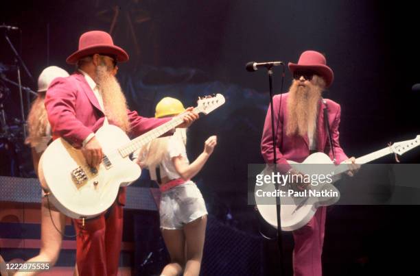 American Rock musicians Dusty Hill and Billy Gibbons, both of the group ZZ Top, perform onstage at the Bradley Center, Milwaukee, Wisconsin, October...