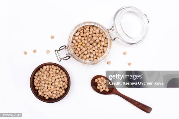 bowl of preserved chickpeas isolated on white background, top view - chick pea stock pictures, royalty-free photos & images