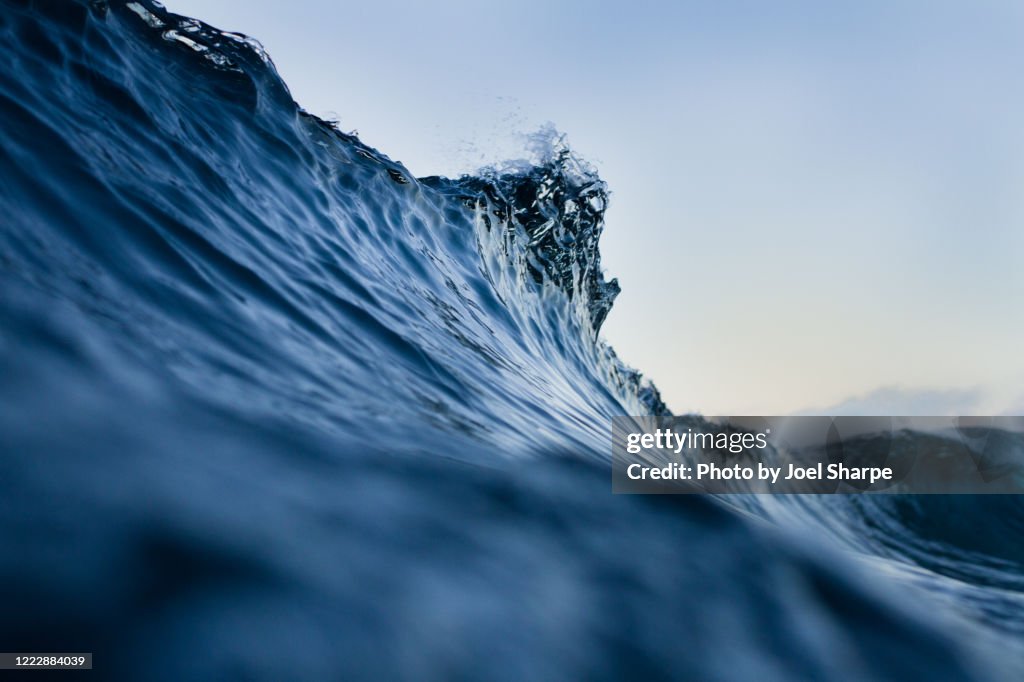 The lip of a silky blue wave