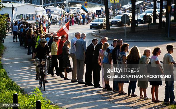 Human chain, the "Chain For Freedom", formed from the Berwaldhallen concert hall in Stockholmon along the Starndvaegen, marks the 20th anniversary of...
