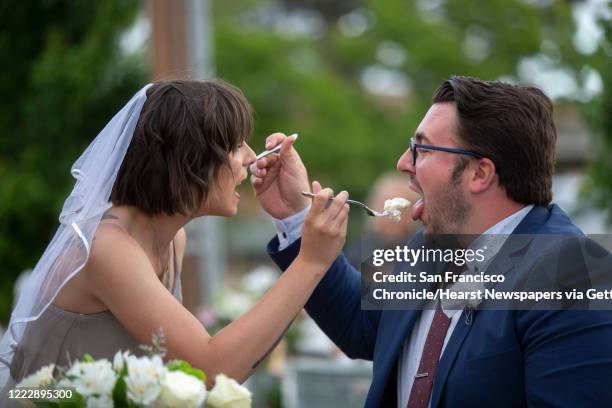 From left: Lindsey Dale and fiancé Sean Widger feed each other cake on Saturday, May 2 in Livermore, Calif. The engaged couple were suppose to get...