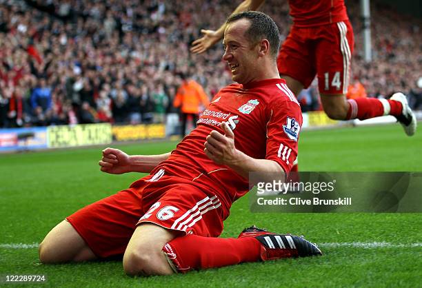 Charlie Adam of Liverpool celebrates scoring his side's third goal during the Barclays Premier League match between Liverpool and Bolton Wanderers at...