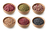 Variety of legumes in wooden bowls. Red kidney beans. Mung beans. Borlotti beans. Chick peas. Azuki beans. Black beans.