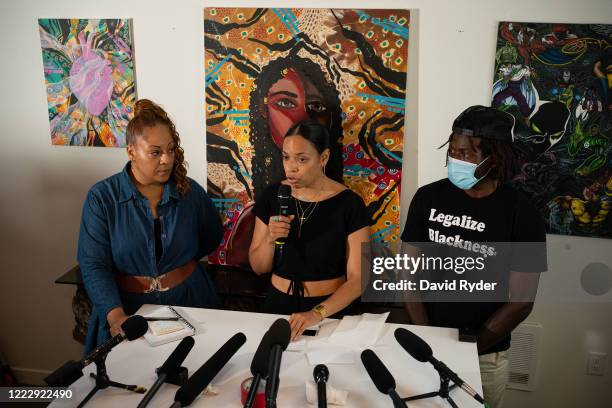 Jesse Miller, Naudia Miller, and Marcus Henderson, who are Black organizers within the Capitol Hill Organized Protest , speak during a press...