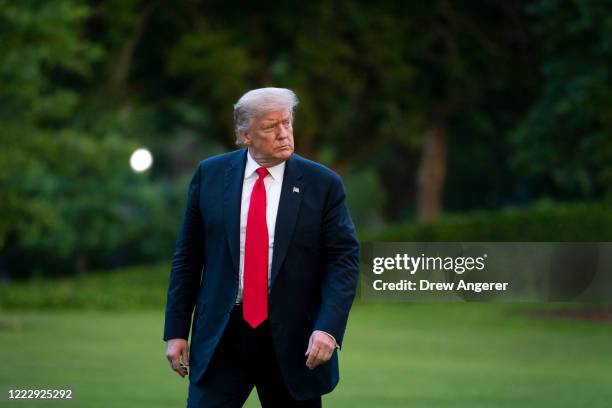 President Donald Trump walks to the White House residence after exiting Marine One on the South Lawn on June 25, 2020 in Washington, DC. President...