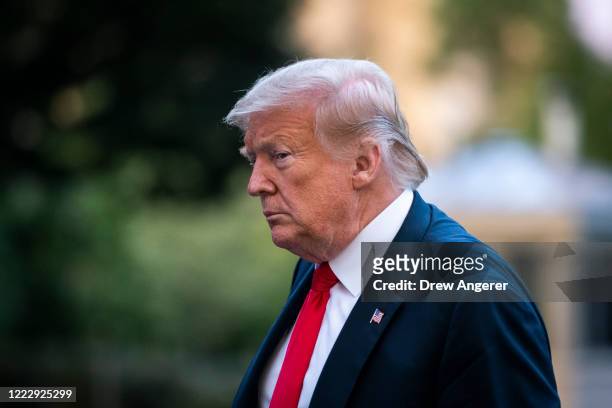 President Donald Trump walks to the White House residence after exiting Marine One on the South Lawn on June 25, 2020 in Washington, DC. President...