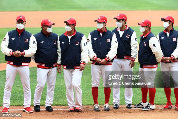 Wyverns players wear masks before the Korean Baseball Organization League opening game between SK Wyverns and Hanwha Eagles at the empty SK Happy...
